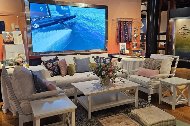 Seating area below a large screen